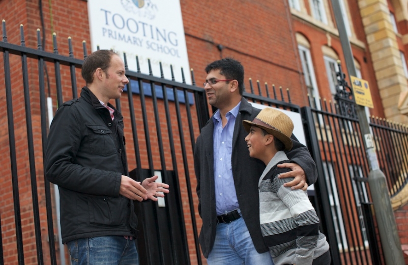 Dan with local parent and son outside the Tooting Primary School